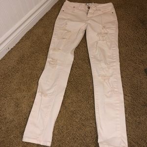 white super ripped jeans with a pinky tone